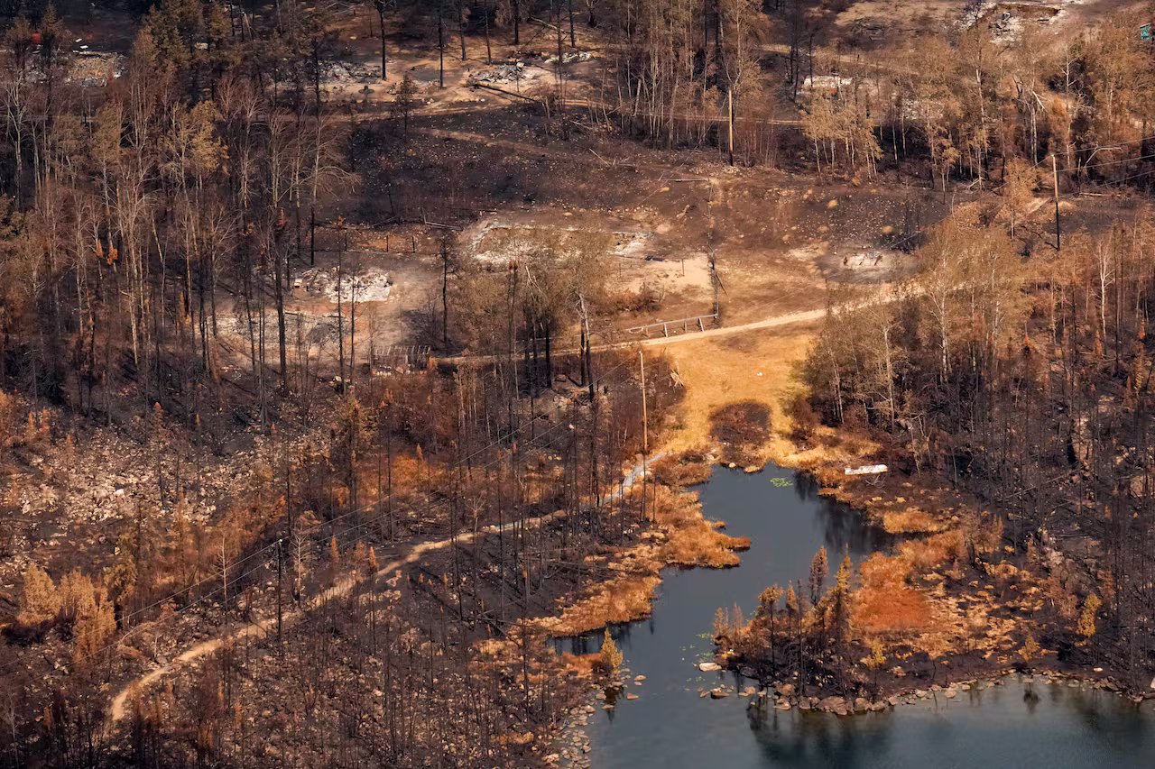 Wildfire damage is captured from the air in Collins First Nation, a small, remote Ojibwa community located in northwestern Ontario, approximately 250 km north of Thunder Bay, Ontario, on Wednesday, July 22, 2026. THE CANADIAN PRESS/Chris Young