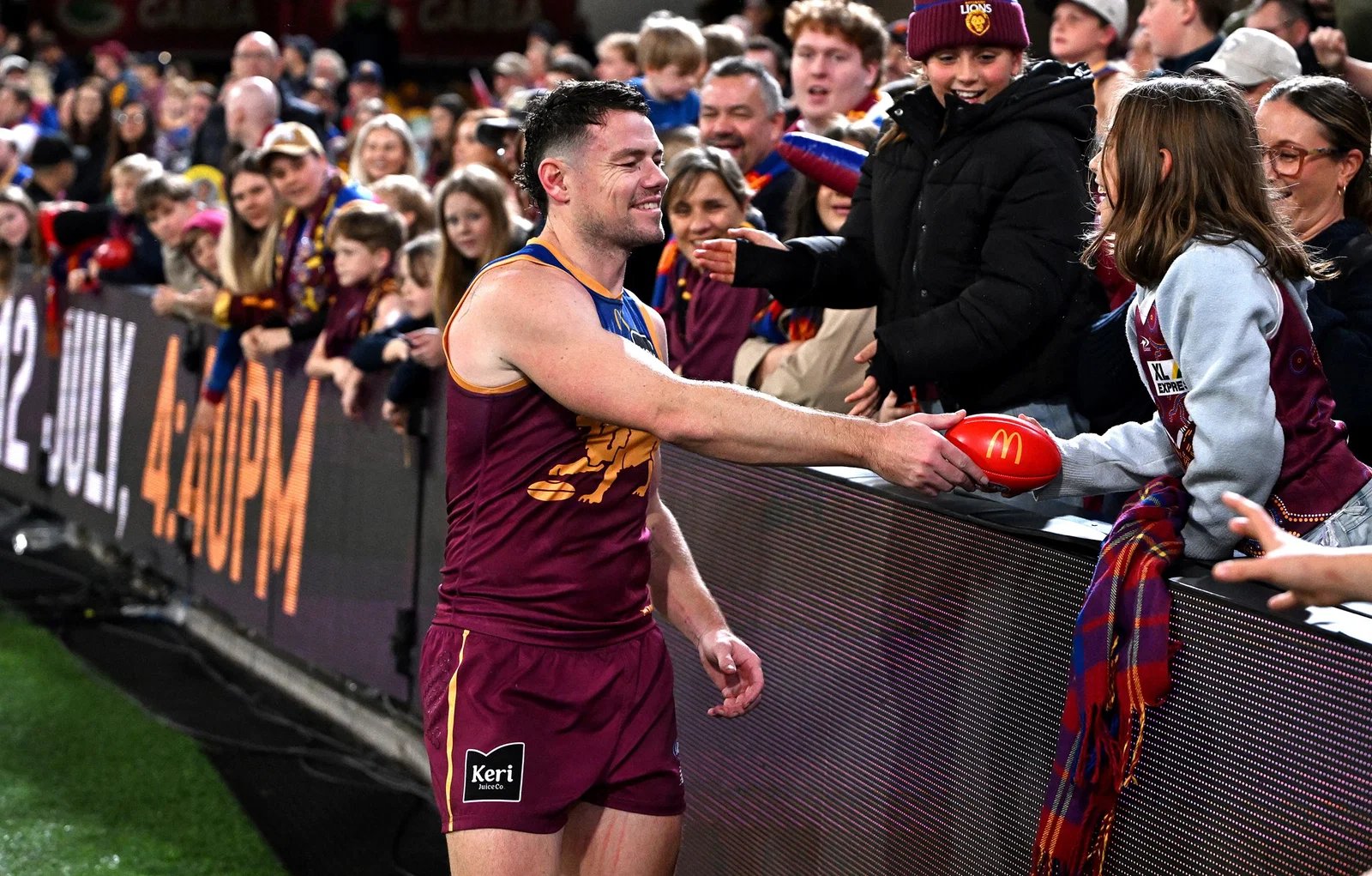 Lachie Neil of the Lions speaks to a young fan after the AFL Round 16 match between Brisbane Lions and Sydney Swans at the Gabba on June 25, 2026 in Brisbane, Australia.