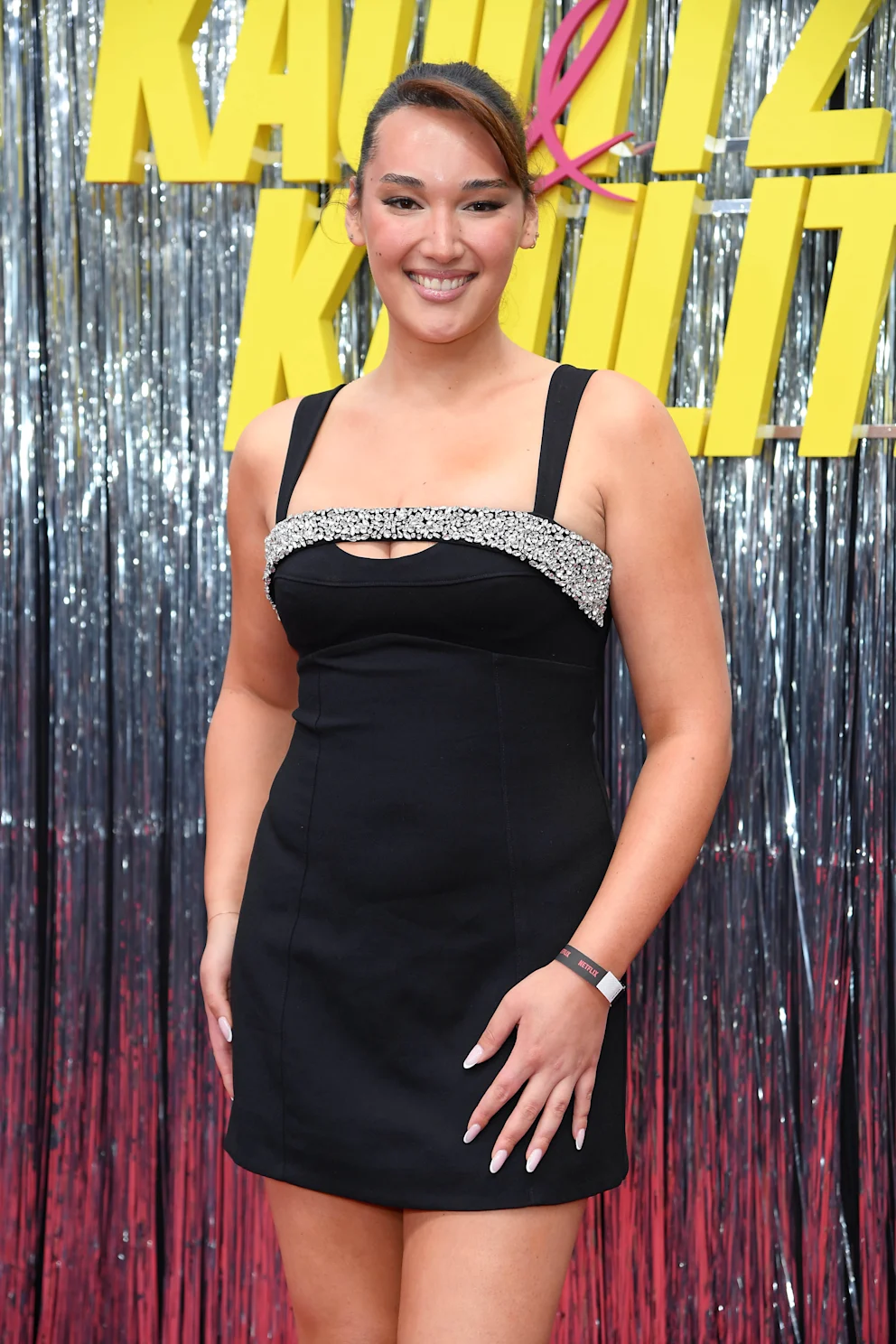 The GNTM winner poses in her black minidress at her new adopted home in Berlin for the premiere of Kaulitz and Kaulitz.