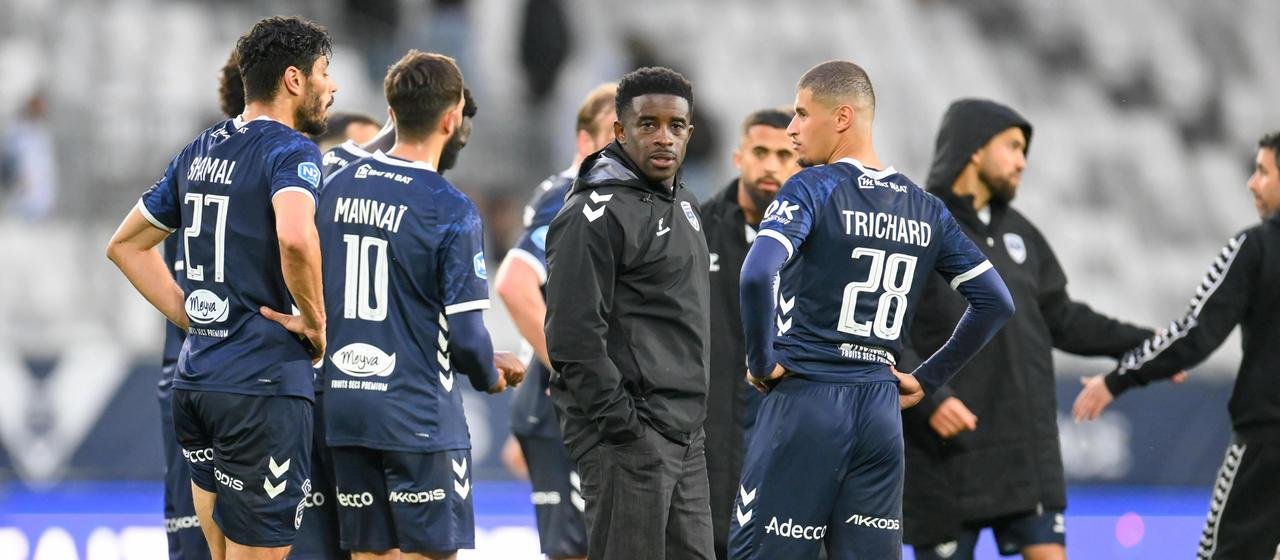 Girondins Bordeaux coach Rio Mavuba and his players look disappointed