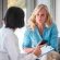 A woman talking to a doctor who keeps records symbolizes the obligation to obtain a second medical opinion. A woman talking to a doctor who keeps records symbolizes the obligation to obtain a second medical opinion.