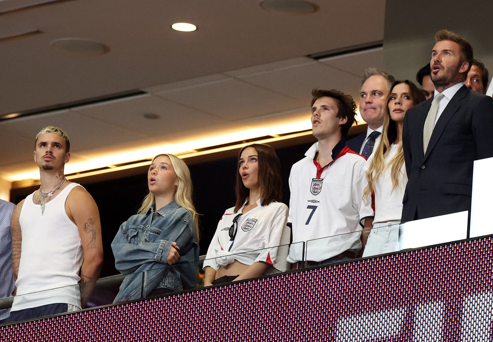 Beckham enjoys the game: his wife Victoria, sons Cruz and Romeo and daughter Harper