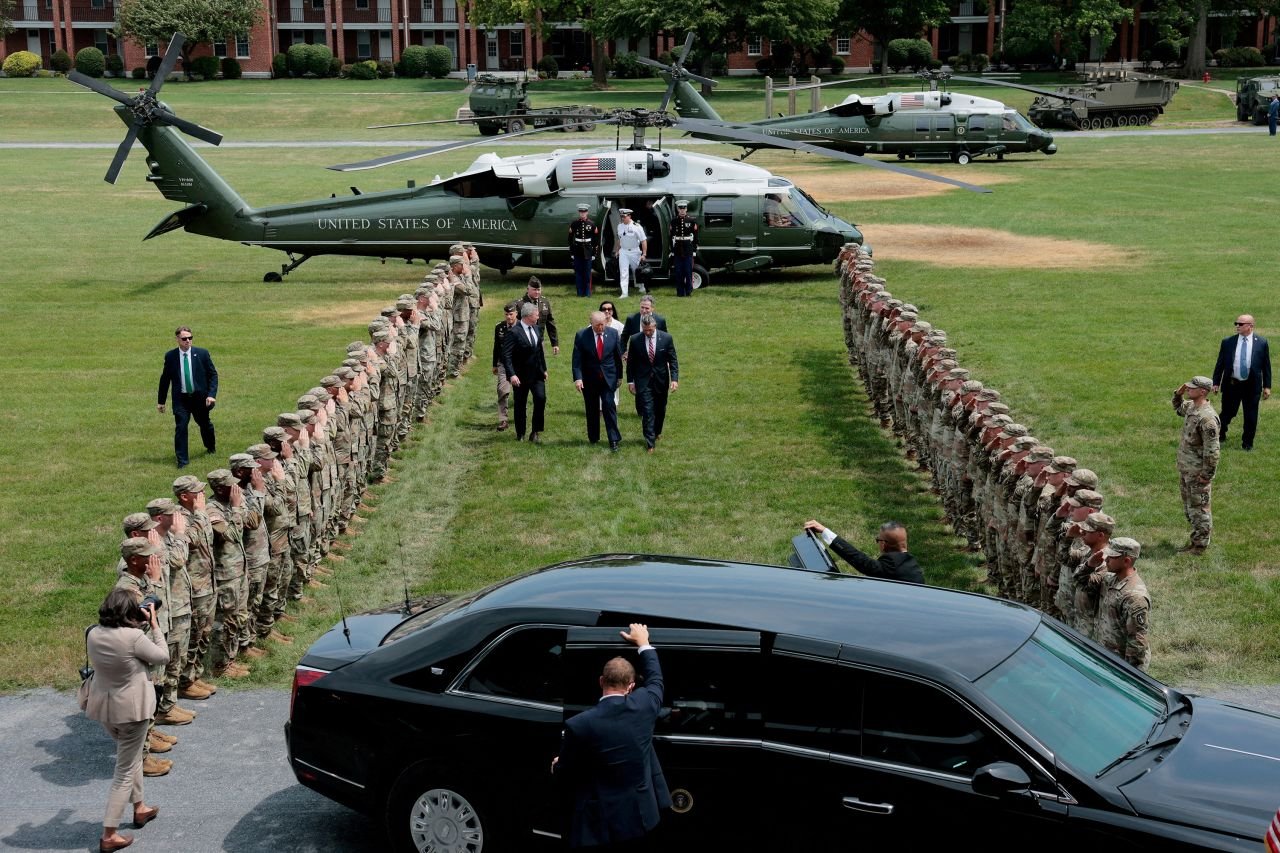 US President Donald Trump walks with Senator Dave McCormick, Dinah Powell McCormick, Defense Secretary Pete Hegseth and Army Secretary Daniel P. Driscoll after arriving aboard Marine One in Carlisle, Pennsylvania, July 15.