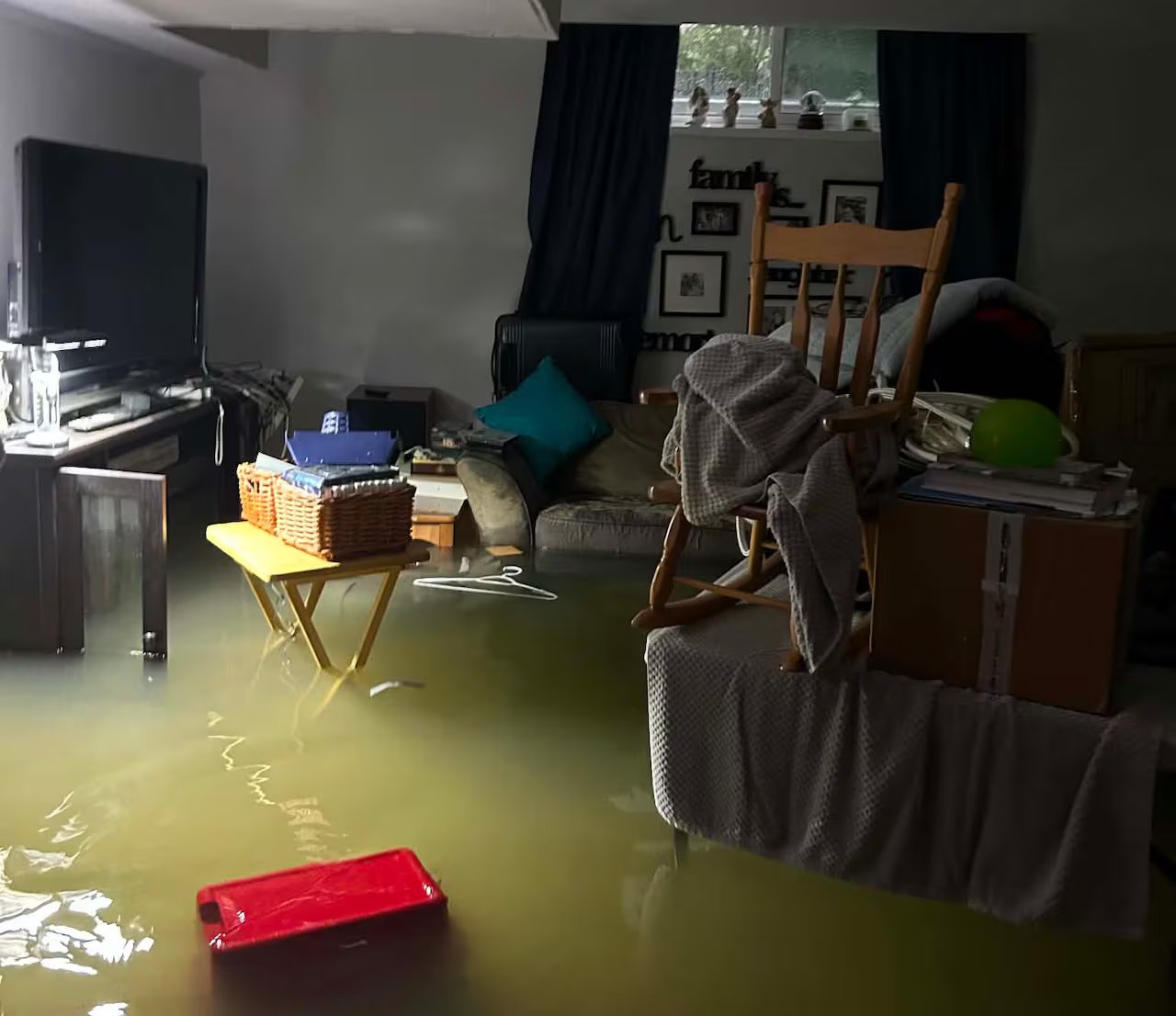 The flooded basement is visible during the day