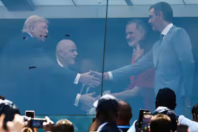 Donald Trump booed before World Cup final 11 Donald Trump shook hands with Spanish President Pedro Sanchez as FIFA chief Gianni Infantino and Spain's King and Queen Felipe VI and Letizia watched.