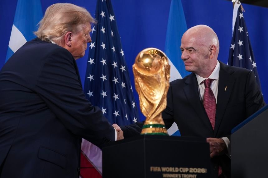 US President Donald Trump shakes hands with FIFA President Gianni Infantino at the FIFA reception at Trump Tower in New York on July 17.