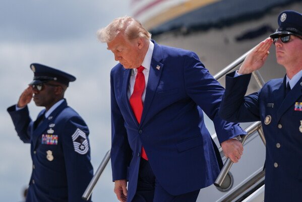 President Donald Trump arrives on Air Force One at Dobbins Air Force Base, Wednesday, July 22, 2026, in Marietta, Ga. (AP Photo/Julia Demaree Nikhinson)