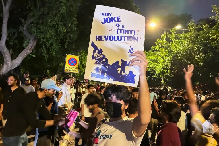 Protester holding a poster with a message 
