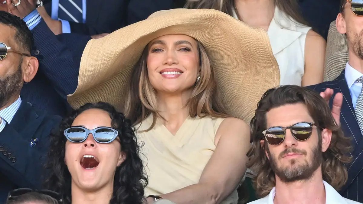 Jennifer Lopez's wide-brimmed hat at Wimbledon sparks backlash on social media 15 Jennifer Lopez, Andrew Garfield and Tom Hiddleston at Wimbledon in London.