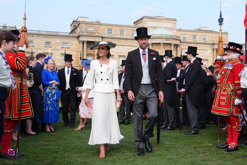 Kate, Princess of Wales, climbed Britain's three highest peaks in 24 hours to raise money for a cancer hospital 11 Catherine and William at a garden party in May.