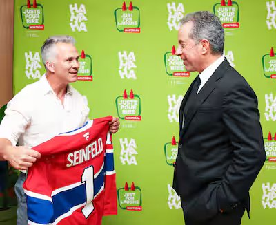 Martin St. Louis meets comedian Jerry Seinfeld 11 Martin St. Louis offered Jerry Seinfeld a Montreal Canadiens jersey.