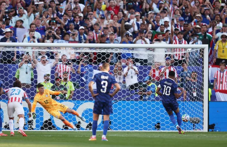 France's Kylian Mbappe scored his first goal against Paraguayan Orlando Gill from the penalty spot.