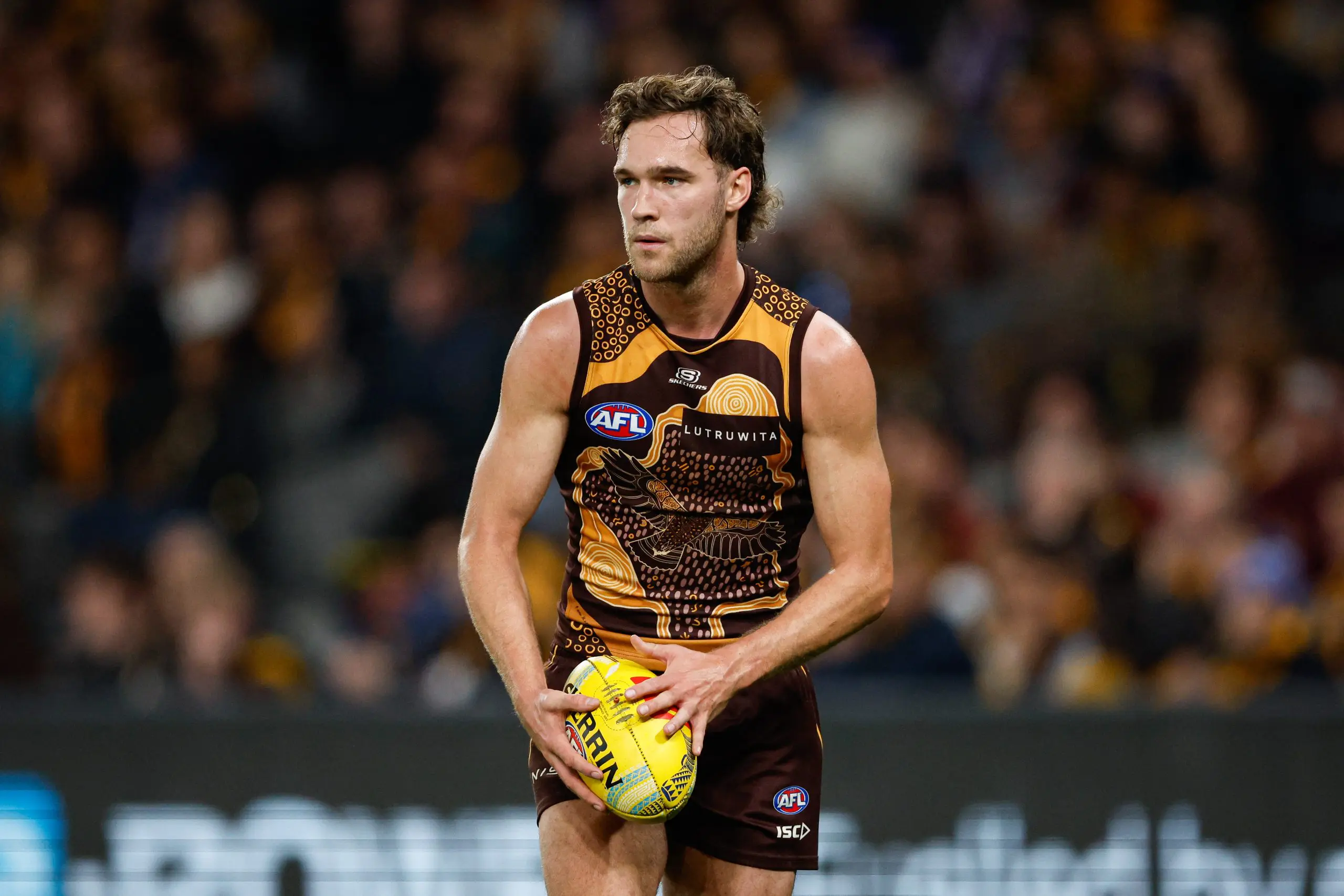 MELBOURNE, AUSTRALIA – MAY 26: Jack Scrimshaw of the Hawks watches the 2024 AFL Round 11 match between the Hawthorn Hawks and the Brisbane Lions at Marvel Stadium on May 26, 2024 in Melbourne, Australia. (Photo by Dylan Burns/AFL Photos via Getty Images)
