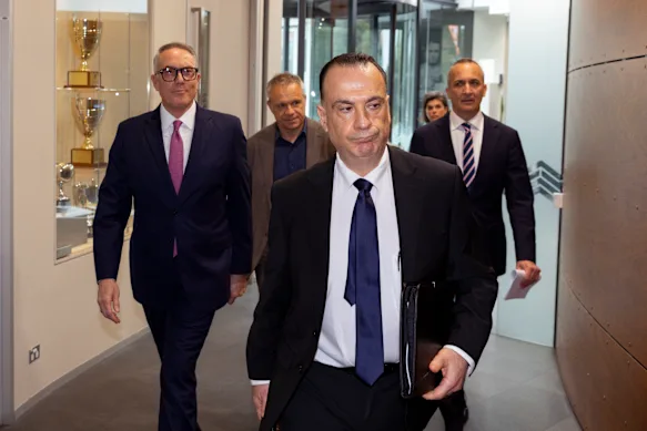 Australian Rugby League Commission chairman Peter W'Landys leads (from left) Foxtel chief executive Patrick Delaney, Nine boss Matt Stanton and outgoing NRL chief Andrew Abdo to a press conference.