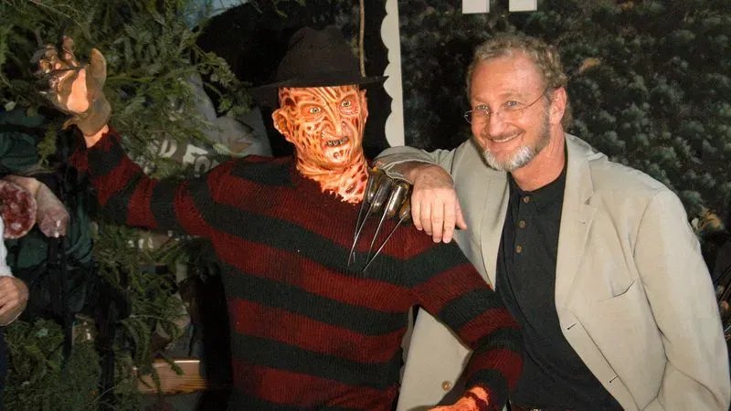 HOLLYWOOD, CA - JANUARY 13: Actor Robert Englund poses with a wax figure of Freddy at the Hollywood Wax Mueum for DVD release debut 