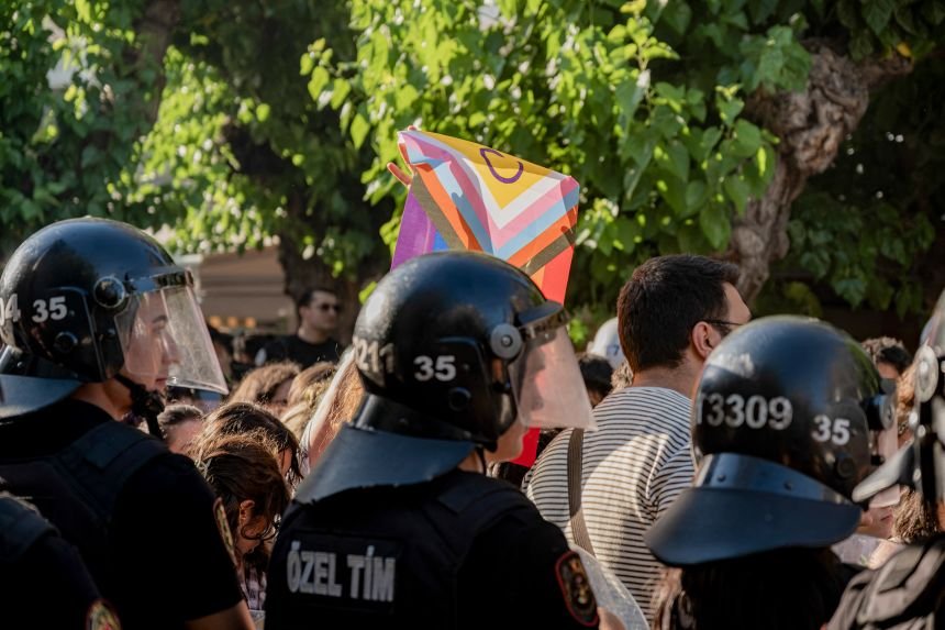 Passengers say twice-turned-down US cruise draws attention to rollback of LGBTQ rights 11 A protester holds a Pride flag in Izmir, Türkiye, June 27 as riot police intervene in a Pride march.