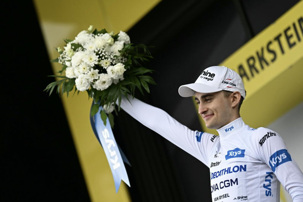 Pogacar strikes again as fight for podium heats up 12 French Decathlon CMA CGM rider Paul Seixas celebrates on the podium with his white jersey as the Tour's best young man after stage 14 in Le Markstein, July 18, 2026.