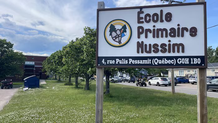 Poster in front of Nusima Primary School.
