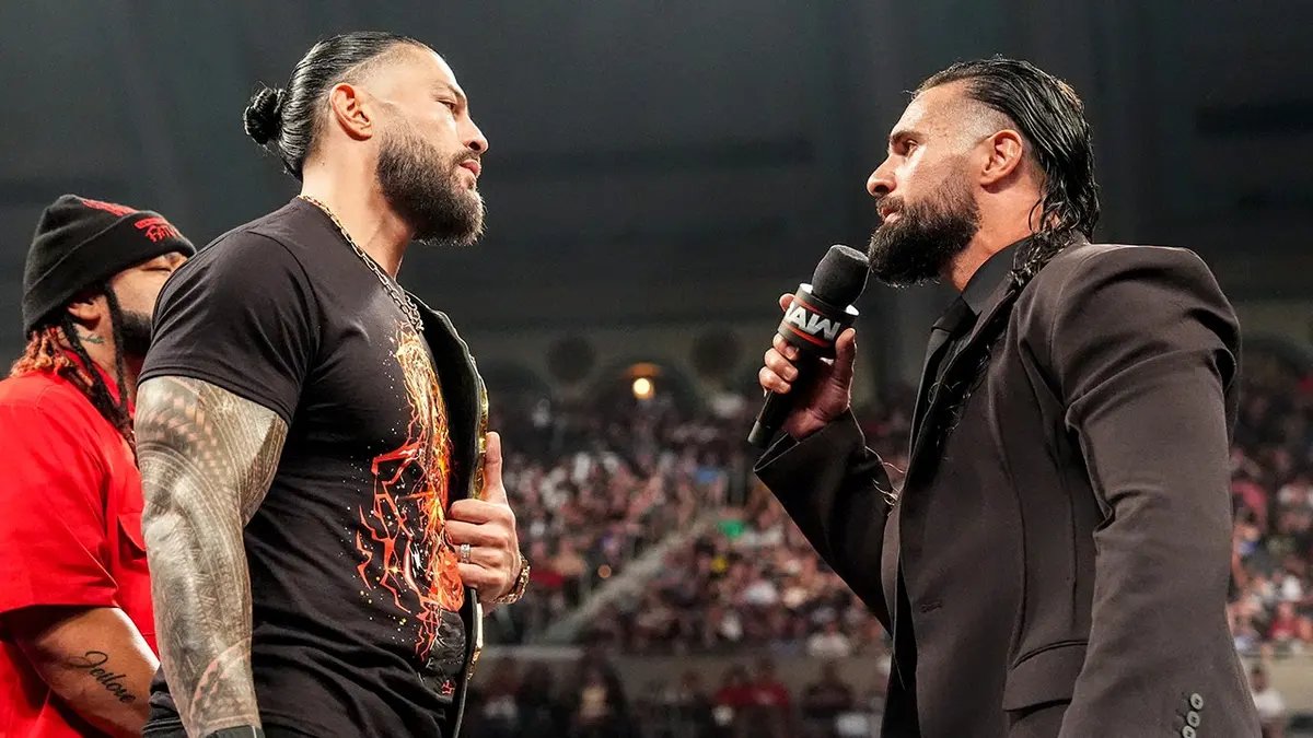 Seth Rollins will challenge Roman Reigns for the world title at SummerSlam 14 Roman Reigns and Seth Rollins talk in the ring during Monday Night RAW at Boardwalk Hall Arena.