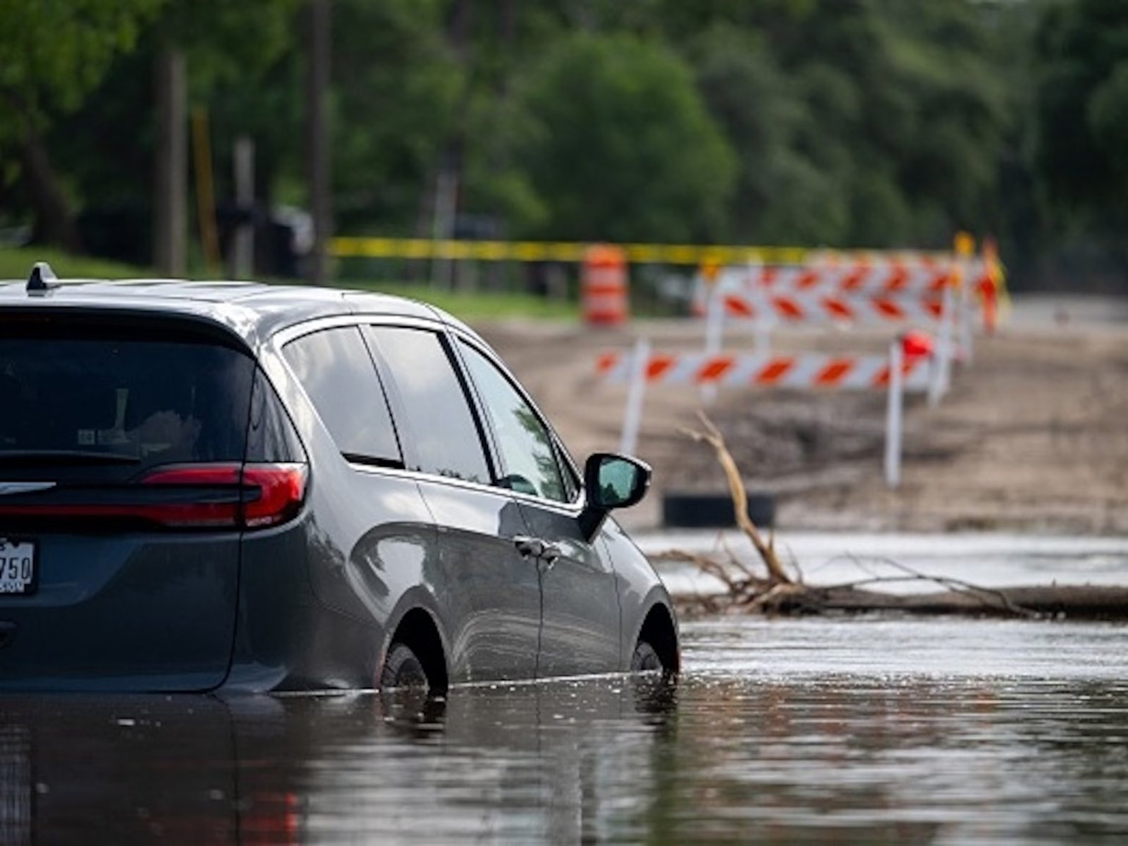 PHOTO: A car becomes stuck in floodwater July 17, 2026, in Uvalde, Texas, after flash floods swept through parts of Central Texas, forcing evacuations and hundreds of water rescues. 