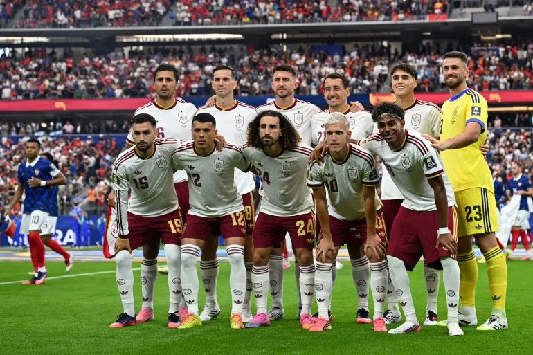 (Bottom left) Spain midfielder no. 15 Alex Baena, Spain defender no. 12 Pedro Porro, Spain defender no. 24 Mark Cucurella, Spain forward no. 10 Dani Olmo, Spain forward no. 19 Lamin Yamal (top left) Spain midfielder no. 16 Rodri, Spain midfielder no. 08 Fabian Ruiz, Spain defender no. 14 Aymeric Laporte, Spain forward no. 21 Mikel Oyarzabal, No. 22 defenseman Pau Kubarsi and No. 23 goalkeeper Unai Simon pose before the 2026 FIFA World Cup semifinal match between France and Spain at Dallas Stadium in Arlington on July 14, 2026. (Photo by MAURO PIMENTEL/AFP)