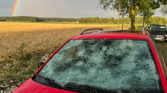 The car was damaged by hail.