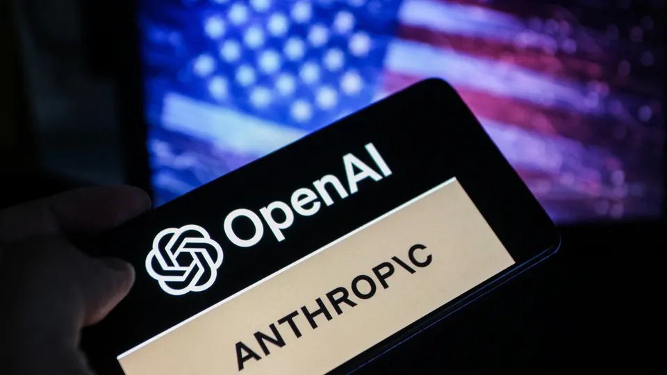 There is one way to win the artificial intelligence race, and major labs are lobbying for it 11 The smartphone screen displays the OpenAI and Anthropic logos against a blurred American flag background.