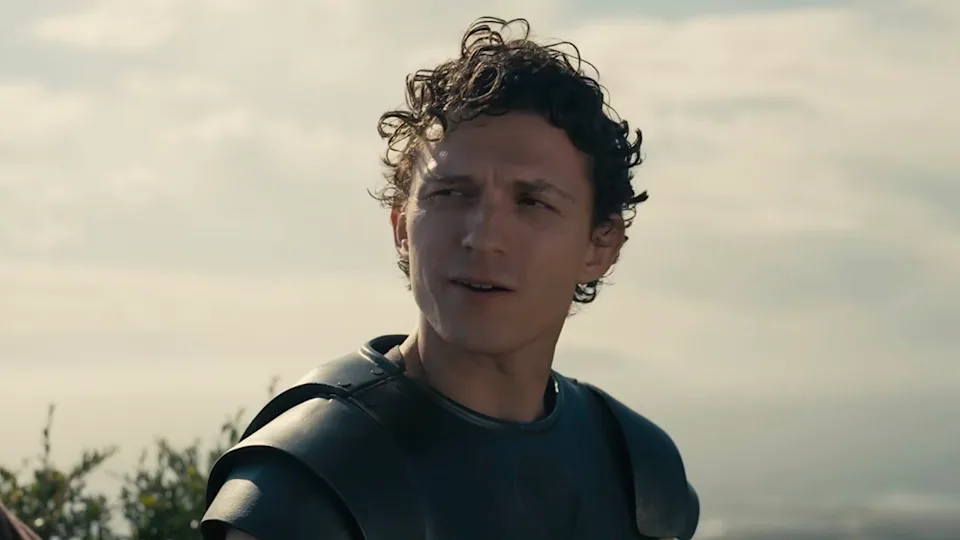 Tom Holland on the beach in the Odyssey trailer. .