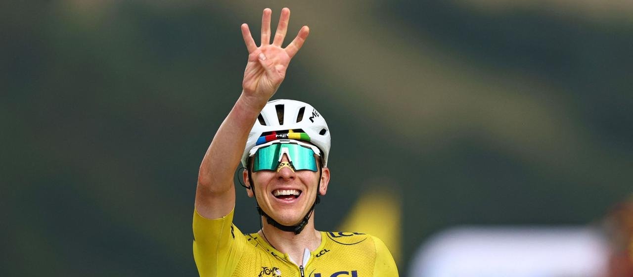 Pogacar winner celebrates the finish of the 14th stage 