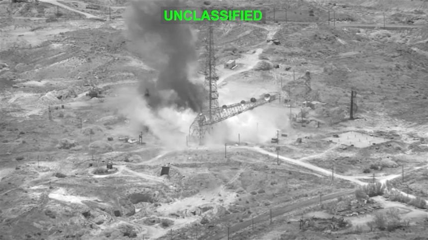 Smoke rises from an explosion at an undisclosed location during what US Central Command says are strikes on Iran. This screenshot is from a handout video released Wednesday.