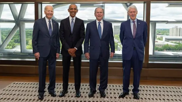 From left to right: Former US Presidents Joe Biden, Barack Obama, George W. Bush and Bill Clinton pose before the opening ceremony of the Barack Obama Presidential Center.