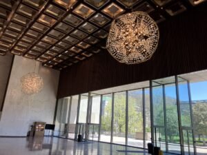The West Virginia Cultural Center's towering Great Hall combines modern architecture with rich natural materials to create an inviting public space that has welcomed millions of visitors since opening during the nation's bicentennial celebrations in 1976. 