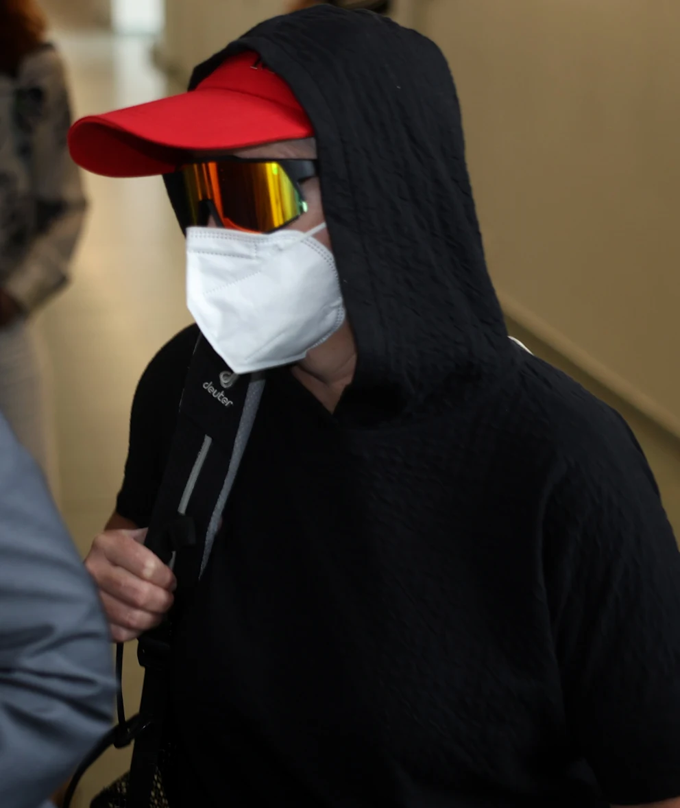 Wilke trial: Did their moldy sausages kill 11 people? | Regional 15 Petite Ronnie M. walks briskly into the courtroom wearing a mask.