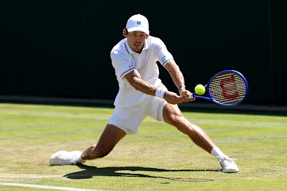 Alex De Minaur plays on the left.
