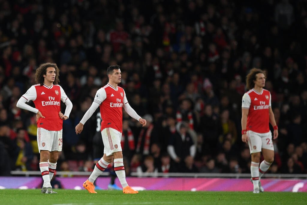 Xhaka is a Swiss rock, born of a World Cup, born of a captain 11 Granit Xhaka (centre) showed his mettle by regaining his place in the Arsenal team despite being stripped of the captain's armband.