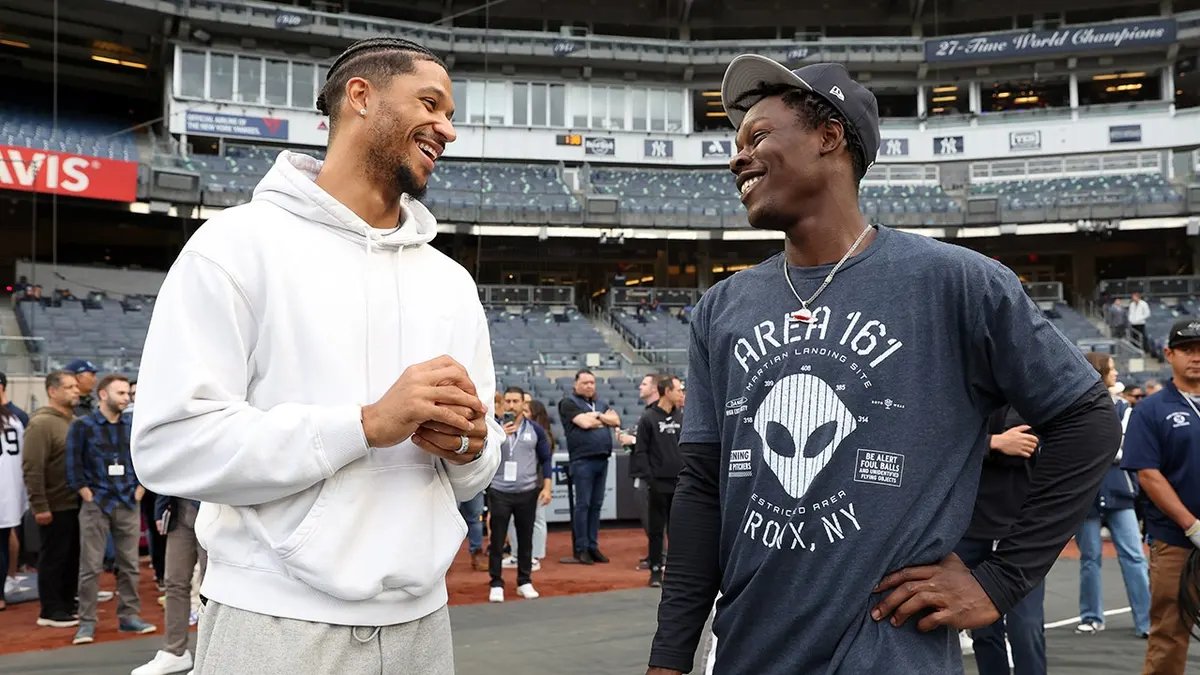 Josh Hart and Jazz Chisholm Jr. talk before a game at Yankee Stadium.