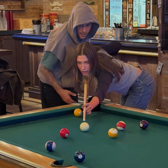Hailey joked "8 years of me being horrendous at playing pool," as she gets tips from Justin