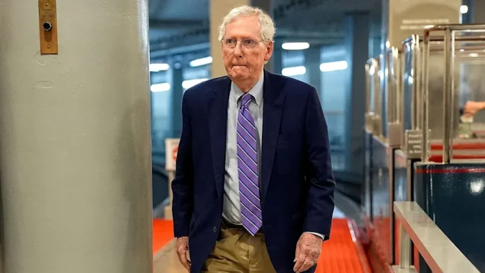 Sen. Mitch McConnell walks in Capitol Hill