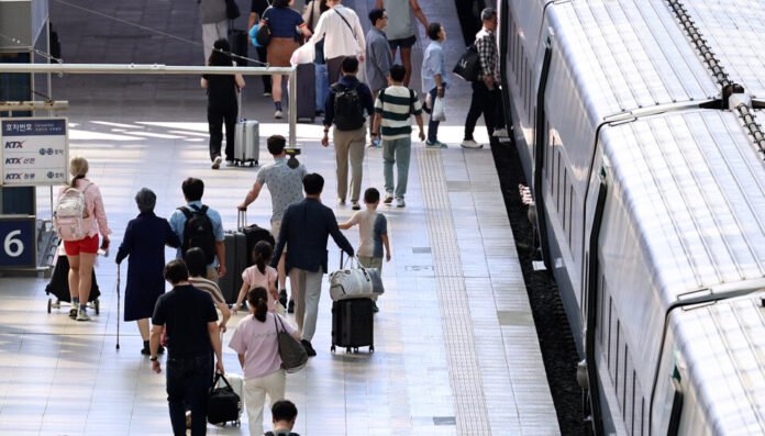 Passengers boarding a train at Seoul Station ahead of the Chuseok holiday